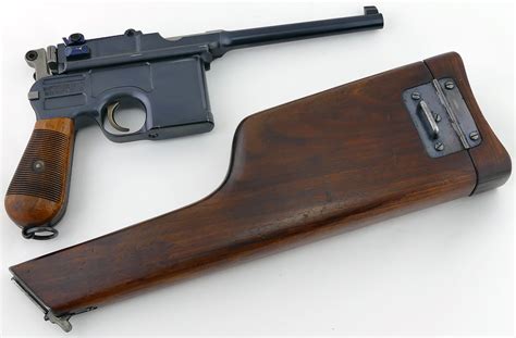 Bottom of pistol grip located lanyard loop. . Mauser c96 9mm